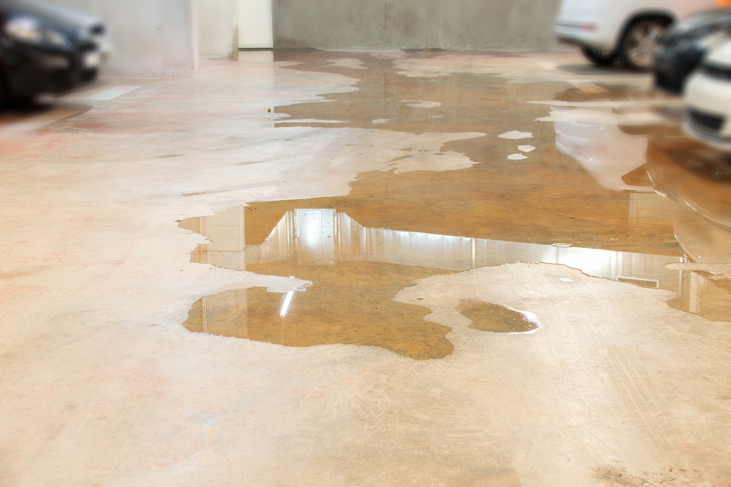 An image of spilled water damage on a garage floor